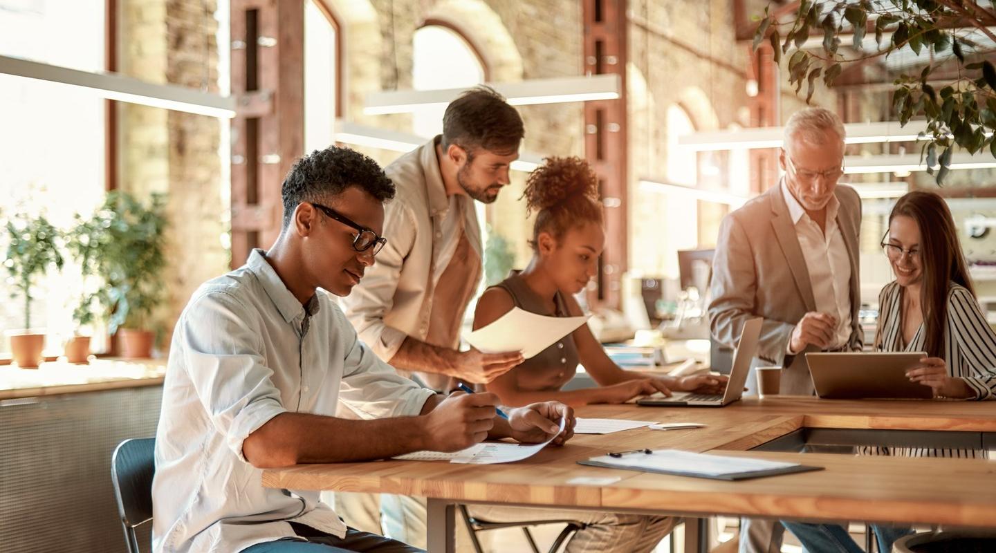 people collaborating at desk