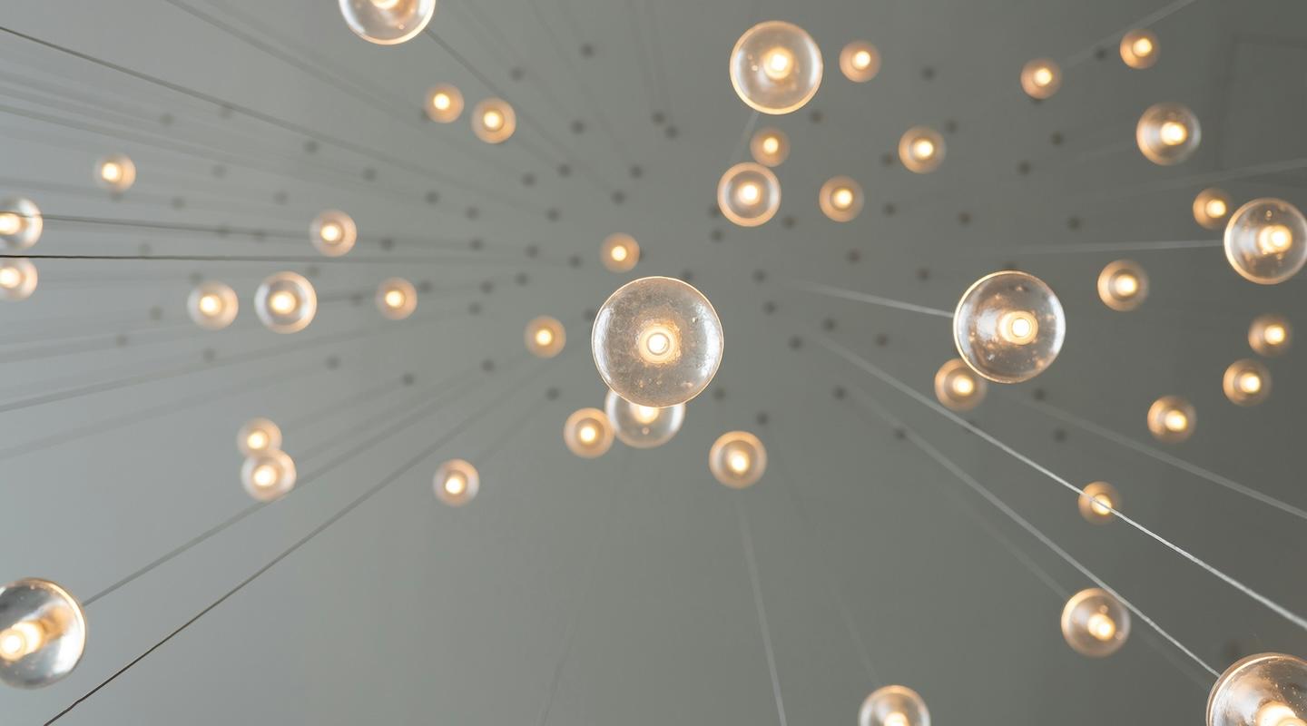Upward view of hanging lightbulbs