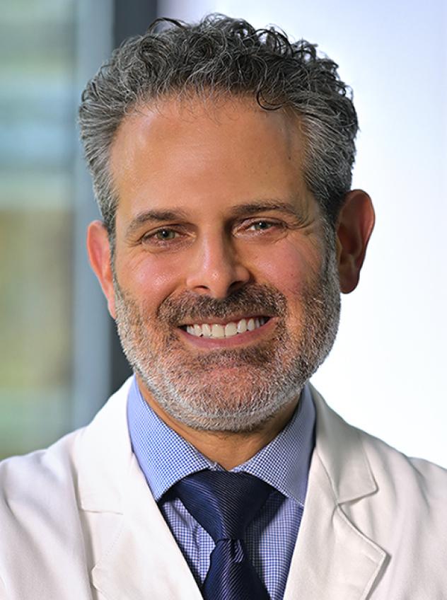 Dr. Seth Rubin in a lab coat and tie